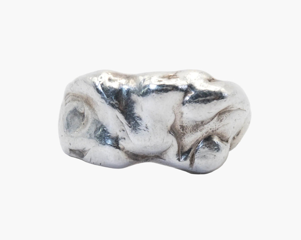 Silver ring with a textured design on a white background